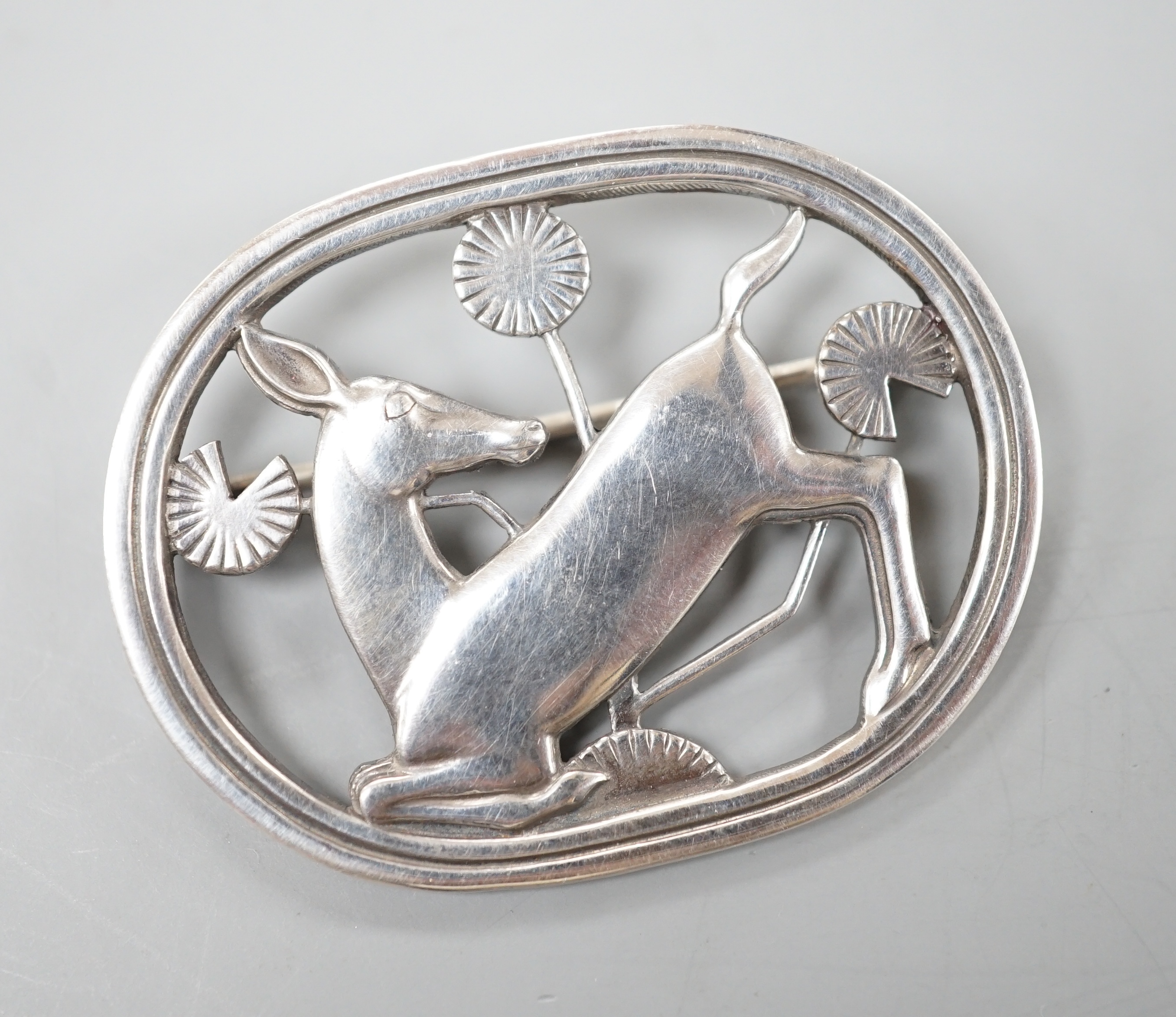 A Georg Jensen sterling 'knelling deer' oval brooch, no. 256, 42mm.